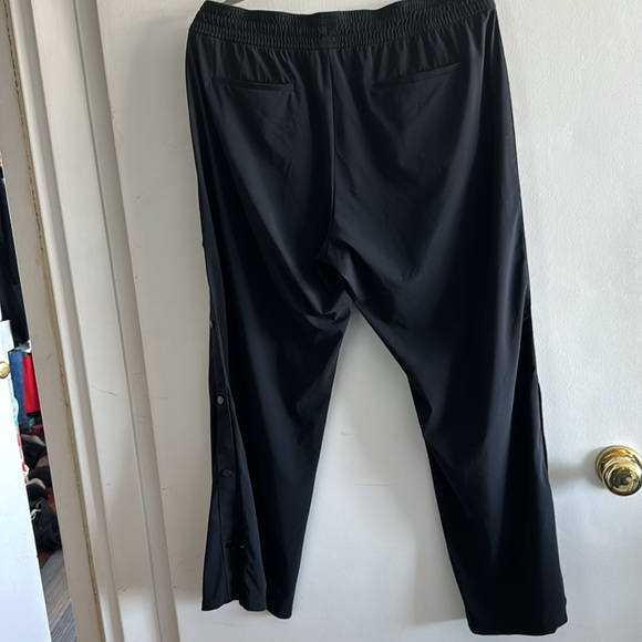 Black track pants with black tuxedo stripe down each leg. - Picture 3 of 4